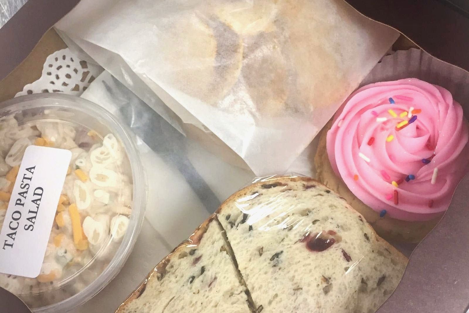 Boxed lunch with pasta salad and a cookie