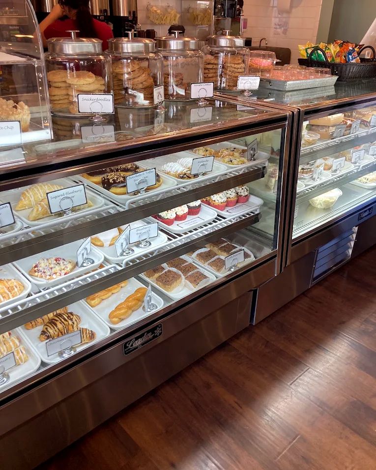 Bakery case filled with pastries and donuts