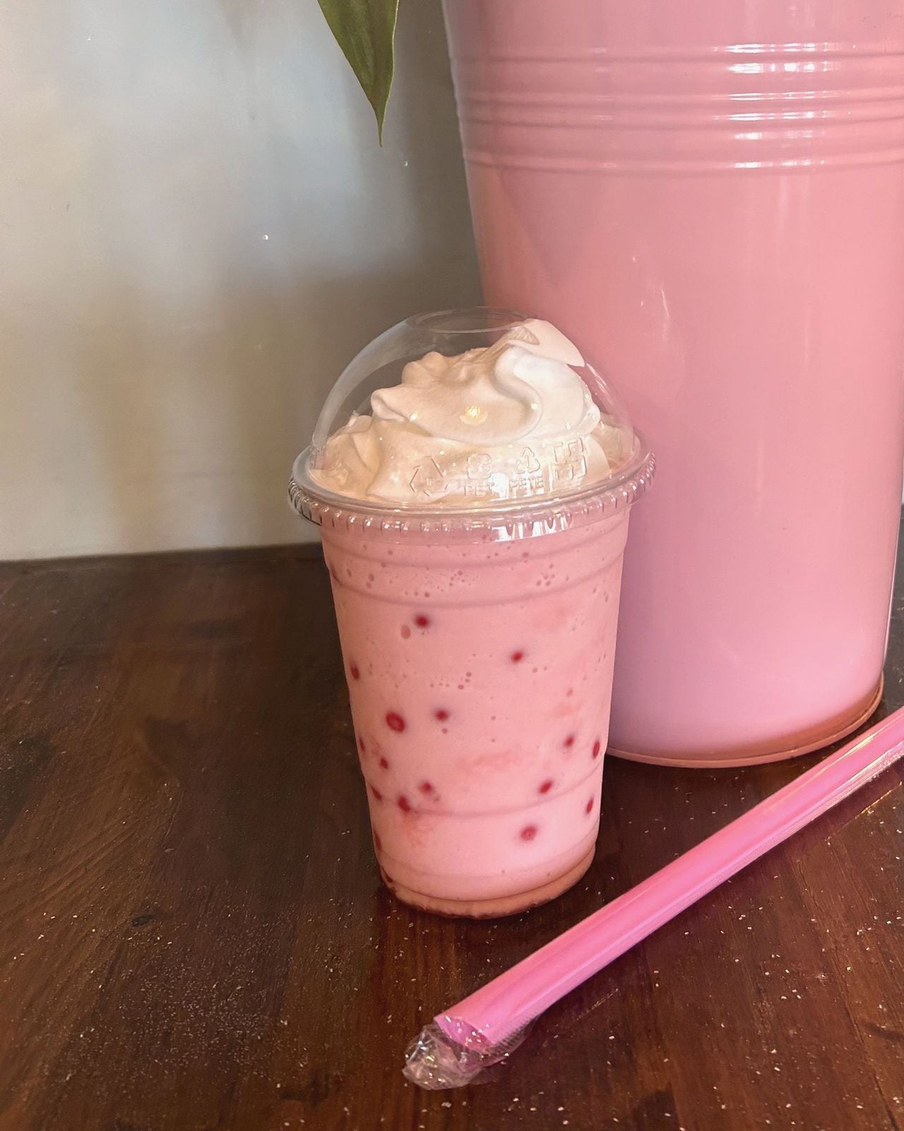 Frozen strawberry drink topped with whipped cream